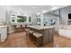 This kitchen features a large island with bar stool seating and stainless steel appliances at 2510 Wood Creek Ct, Dacula, GA 30019