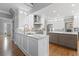 Modern kitchen with granite countertops, stainless steel appliances, and custom cabinetry for a chef's dream at 2510 Wood Creek Ct, Dacula, GA 30019