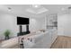 Basement living area featuring a TV, sleek shelving, and comfortable seating, perfect for entertaining and relaxation at 2510 Wood Creek Ct, Dacula, GA 30019