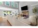 Bright living room with fireplace and large windows providing natural light at 2510 Wood Creek Ct, Dacula, GA 30019
