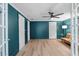 Stylish office featuring teal walls, modern flooring, and natural light, providing an inspiring workspace at 2510 Wood Creek Ct, Dacula, GA 30019