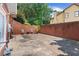 Brick patio area with chairs surrounded by a brick privacy wall at 2510 Wood Creek Ct, Dacula, GA 30019