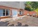 Brick patio area with chairs and outdoor access; ideal for relaxing or entertaining guests at 2510 Wood Creek Ct, Dacula, GA 30019