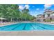 A luxurious pool with lounge chairs and a clubhouse create an inviting outdoor experience at 2510 Wood Creek Ct, Dacula, GA 30019