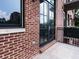 Brick balcony with iron railing and glass paneled french doors overlooking the building next door at 3235 Roswell Ne Rd # 514, Atlanta, GA 30305