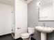 Contemporary bathroom featuring a pedestal sink and a walk-in shower with glass door at 3235 Roswell Ne Rd # 514, Atlanta, GA 30305