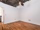 Loft-style bedroom with hardwood floors, exposed pipes, and lots of natural light at 3235 Roswell Ne Rd # 514, Atlanta, GA 30305