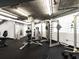 Well-equipped gym featuring various weight machines, free weights, and concrete ceiling at 3235 Roswell Ne Rd # 514, Atlanta, GA 30305