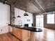 Modern kitchen with sleek countertops, stainless steel appliances, chandelier and exposed ductwork at 3235 Roswell Ne Rd # 514, Atlanta, GA 30305