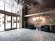 Spacious lobby featuring comfortable seating, exposed brick walls, and large windows at 3235 Roswell Ne Rd # 514, Atlanta, GA 30305