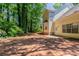 View of the back exterior of house features a yard and mature trees at 3470 River Mill Ln, Ellenwood, GA 30294