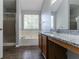 Bathroom features a soaking tub, shower and double vanity with modern fixtures at 3470 River Mill Ln, Ellenwood, GA 30294