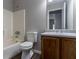 Bathroom features a tub/shower, white toilet, and vanity with storage at 3470 River Mill Ln, Ellenwood, GA 30294