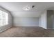 Spacious bedroom featuring carpet and a bright window at 3470 River Mill Ln, Ellenwood, GA 30294