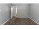 Bright bedroom features neutral walls, plush carpeting, and an open doorway at 3470 River Mill Ln, Ellenwood, GA 30294