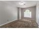 Cozy bedroom with carpet, neutral walls, and natural light at 3470 River Mill Ln, Ellenwood, GA 30294