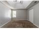 Bright bedroom with a ceiling fan, neutral walls, plush carpeting, and large closet at 3470 River Mill Ln, Ellenwood, GA 30294