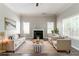 Comfortable living room with a fireplace, two sofas, and two armchairs at 3470 River Mill Ln, Ellenwood, GA 30294