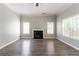 Spacious living room features a cozy fireplace and plenty of natural light at 3470 River Mill Ln, Ellenwood, GA 30294