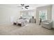 Spacious primary bedroom with sitting area, and lots of natural light at 4711 Oakleigh Manor Dr, Powder Springs, GA 30127