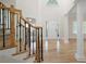 Bright and airy foyer with hardwood floors, staircase, and natural light at 4711 Oakleigh Manor Dr, Powder Springs, GA 30127