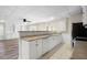 Kitchen featuring white cabinets, stainless steel appliances and a breakfast bar at 4711 Oakleigh Manor Dr, Powder Springs, GA 30127