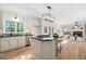 Open concept kitchen with granite counters, stainless appliances, and views to the Gathering room at 4711 Oakleigh Manor Dr, Powder Springs, GA 30127