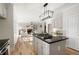 Spacious kitchen with a large island, stainless appliances, and seamless flow to the Gathering room at 4711 Oakleigh Manor Dr, Powder Springs, GA 30127