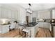 Well-equipped kitchen featuring a center island with cooktop, stainless appliances, and ample counter space at 4711 Oakleigh Manor Dr, Powder Springs, GA 30127