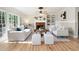 Inviting living room featuring a brick fireplace, hardwood floors, and comfortable seating at 4711 Oakleigh Manor Dr, Powder Springs, GA 30127