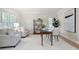 Bright home office featuring neutral colors, desk, shelving, and comfortable seating at 4711 Oakleigh Manor Dr, Powder Springs, GA 30127