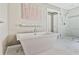 Elegant bathroom featuring a freestanding soaking tub and a view of a large glass shower at 8045 Depford Way, Cumming, GA 30041