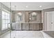 Elegant bathroom with double vanities, a glass-enclosed shower, and marble flooring at 8045 Depford Way, Cumming, GA 30041