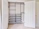 Walk-in closet with ample shelving, multiple drawers and wire basket storage is thoughtfully designed at 8045 Depford Way, Cumming, GA 30041