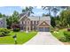 Charming two-story brick home with a manicured lawn and a two-car garage at 8045 Depford Way, Cumming, GA 30041
