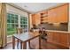 Bright home office with custom built-ins, hardwood floors, and large window at 8045 Depford Way, Cumming, GA 30041