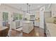 Bright kitchen featuring a center island, stainless appliances, and plenty of storage space at 8045 Depford Way, Cumming, GA 30041