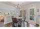 Kitchen featuring a breakfast table, hardwood floors, lots of natural light, and access to an outdoor porch at 8045 Depford Way, Cumming, GA 30041