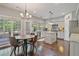 Eat-in kitchen features stainless appliances, granite counters, a center island, and plenty of cabinet space at 8045 Depford Way, Cumming, GA 30041