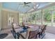 Inviting sunroom filled with natural light, featuring comfortable seating and views of the beautiful backyard at 8045 Depford Way, Cumming, GA 30041