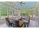 Bright sunroom with large windows, offering a serene space to relax and enjoy the outdoor scenery at 8045 Depford Way, Cumming, GA 30041