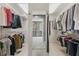 Organized walk-in closet with ample storage and a view of the ensuite bathroom at 8045 Depford Way, Cumming, GA 30041