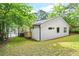 The backyard features a nice, level grassy yard and a view of the rear exterior of the home at 1111 Edgefield Sw Dr, Atlanta, GA 30310