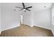 Spacious bedroom features new floors, white walls, a ceiling fan, closet with double doors, and white trim at 1111 Edgefield Sw Dr, Atlanta, GA 30310