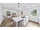 Bright, open kitchen featuring a quartz island, stainless steel appliances, and seamless flow into the living area at 1111 Edgefield Sw Dr, Atlanta, GA 30310