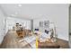 Modern living area flowing into the kitchen and dining space, with hardwood floors and contemporary decor at 1111 Edgefield Sw Dr, Atlanta, GA 30310