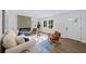 Inviting living room with fireplace, hardwood floors, comfortable seating, and a bright front door at 1111 Edgefield Sw Dr, Atlanta, GA 30310