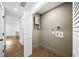 A look at the utility room featuring modern water heater, and new flooring at 1111 Edgefield Sw Dr, Atlanta, GA 30310