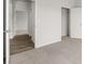Bedroom with neutral carpet, closet, and hallway with wood floors at 408 Oak View Ln, Dallas, GA 30157