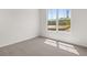 Bedroom featuring a window with natural light and neutral carpet at 408 Oak View Ln, Dallas, GA 30157